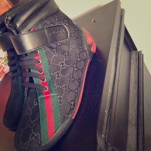 Size 9 women’s Gucci high tops